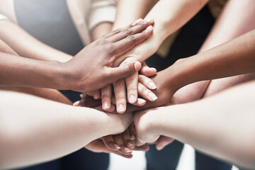 Poster - The best support network. Shot of a group of people putting their hands together.