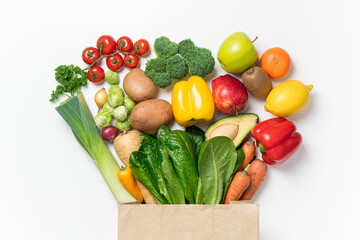 Wall Mural - Healthy food background. Healthy food in paper bag vegetables and fruits on white. Shopping food supermarket concept. Food delivery, groceries, vegan, vegetarian eating. Top view