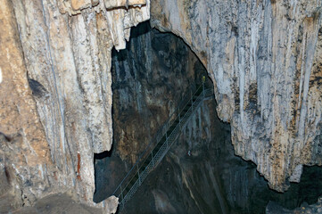 Crimea, Ukraine. Stalactites, stalagmites on the walls of the Emine-Bair-Khosar cave. Template for design. Selective sharpness.