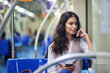 © Arnéll K/peopleimages.com - The train can sometimes be a great place to think. Cropped shot of a young attractive woman using a cellphone while commuting with the train.