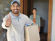© Yuri A/peopleimages.com - You can count on us to get your packages delivered. Portrait of a smiling young courier giving a thumbs up and carrying a package with a customer standing at her front door in the background.