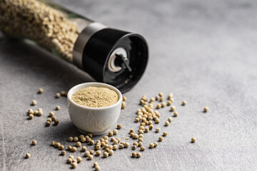 Wall Mural - White ground pepper and whole peppercorn spice in bowl.