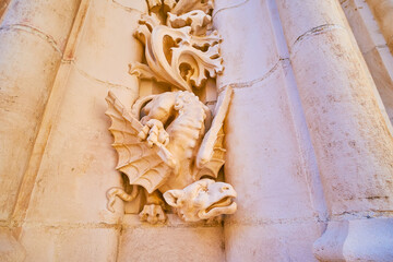 Wall Mural - The wall sculpture of dragon, Prince's Gate of Seville Cathedral, Spain