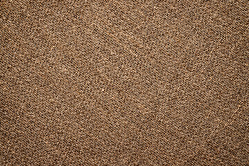 light brown burlap fabric texture. natural grunge background