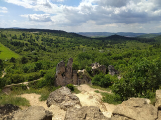 Wall Mural - A scenic landscape and camel rock formation in Pilisborosjeno, Hungary with a cloudy sky in the background