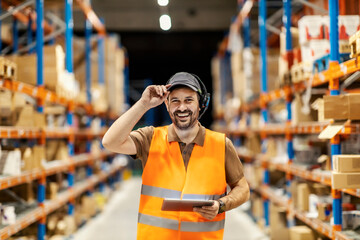 A delivery service man with voice picking headset and tablet is ready for work.