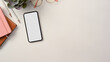 © bongkarn - A modern minimal workspace with smartphone and copy space on white table.