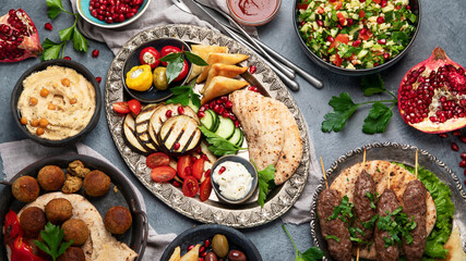 Wall Mural - Arabic food assortment on dark background.