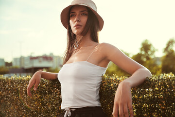 Wall Mural - Trendy woman in bucket hat in street