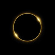 © thekopmylife - Solar eclipse in golden light in black background.
