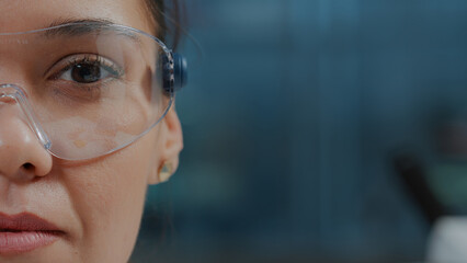 Wall Mural - woman scientist wearing protective glasses with virtual reality in science laboratory. chemistry spe