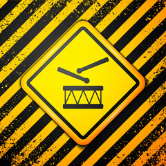 Canvas Print - Black Drum with drum sticks icon isolated on yellow background. Music sign. Musical instrument symbol. Warning sign. Vector