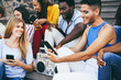 © DisobeyArt - Young diverse people listening music with boombox stereo outdoor - Focus on man face with make-up face