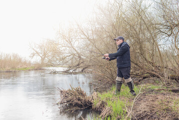 Wall Mural - Fishing on the river bank.