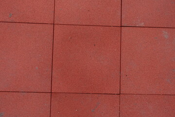 Wall Mural - Surface of brownish red EPDM synthetic rubber floor