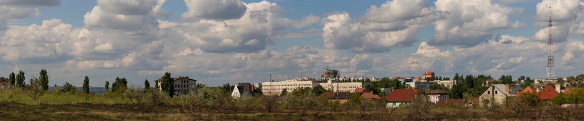 Wall Mural - Outskirts of Chisinau. Panorama with the capital of Moldova. Cloudy sky before the rain.