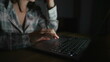 © Marco - Woman browsing internet in front of laptop screen at night