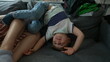 little boy upside down on sofa at home playful child at home playing