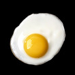Closeup photo of fried egg isolated on black background