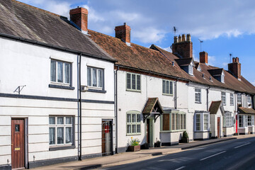 Sticker - England UK. Traditional houses and cottages in an English Village. Suitable for articles on housing market, finance, mortgage, cost of living etc. Generic property image.