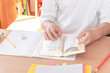 © Kana Design Image - English learning The student using an English dictionary at home. 英語学習。自宅で英語の辞書を活用している生徒。