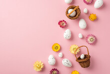 Top View Photo Of Easter Decorations Wild Flowers And Easter Baskets With Eggs On Isolated Pastel Pink Background With Empty Space