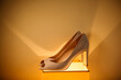 © ADDICTIVE STOCK - Stylish shoes under yellow light
