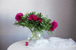 Peonies in a vase on the table