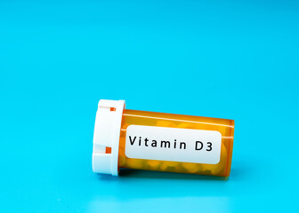 Poster - Vitamin D3  Medical vial with pills. Medical pills in orange Plastic Prescription. most popular medicine