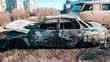 An old burnt-out car after a fire