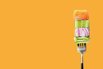 Wall Mural - Close-up of fork with food on it: delicious fillet salmon, cucumber, onion, green salad on orange background. Concept of healthy diet and clean eating, balanced nutrition space for text