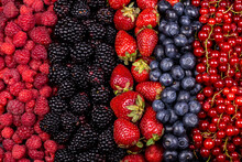 Different Berry Fruits Background. Strawberry, Blueberry, Raspberry, Red Currant And Blackberry Mix.