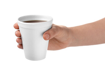 Woman holding styrofoam cup with coffee on white background, closeup