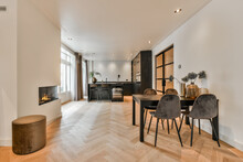 Modern Kitchen With Black Furniture And Wooden Floor