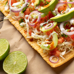 Snack made with wheat flour called chicharron preparado with sauce and vegetables. Mexican food