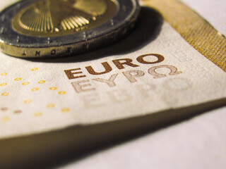 Sticker - A closeup shot of 1 euro and 50 euro banknote