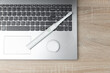 Electro toothbrush with dental floss on laptop keyboard