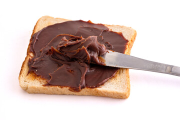 choco spread with bread on white background