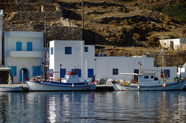 Wall Mural - Picturesque view over port town with blue domes, roofs and churches in travel and honeymoon destination Amorgos in the Greek Islands in the Aegean Sea during Mediterranean cruise Summer	