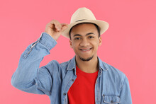 Young Man In Hat On Pink Background