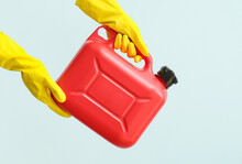 Female Hands In Rubber Gloves Holding Canister On Color Background