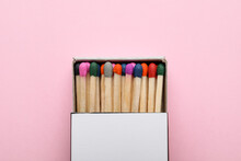 Box With New Matchsticks On Pink Background