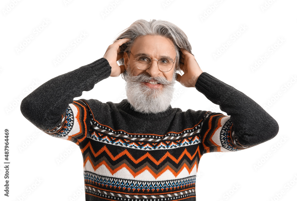 Handsome senior man in knitted sweater on white background