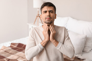 Poster - Ill young man with sore throat at home