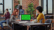 © DC Studio - Asian women analyzing green screen on computer in office, working with chroma key copy space to plan business growth. Partners using blank isolated template and mockup background.