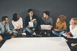 © Camerene P/peopleimages.com - Discussing and researching ideas at the same time. Studio shot of a diverse group of creative employees having a meeting inside.