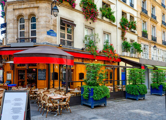 Wall Mural - typical view of the parisian street with tables with tables of cafe in paris, france. architecture a