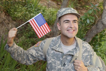 Proud US army soldier waving the American flag