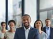 © Delmaine Donson/peopleimages.com - Positive leaders create productive teams. Cropped shot of a group of businesspeople standing in the office.