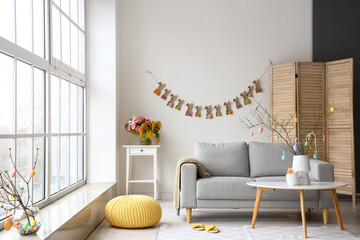 Interior of stylish living room decorated for Easter celebration